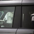 Close-up of a car door with window and handle