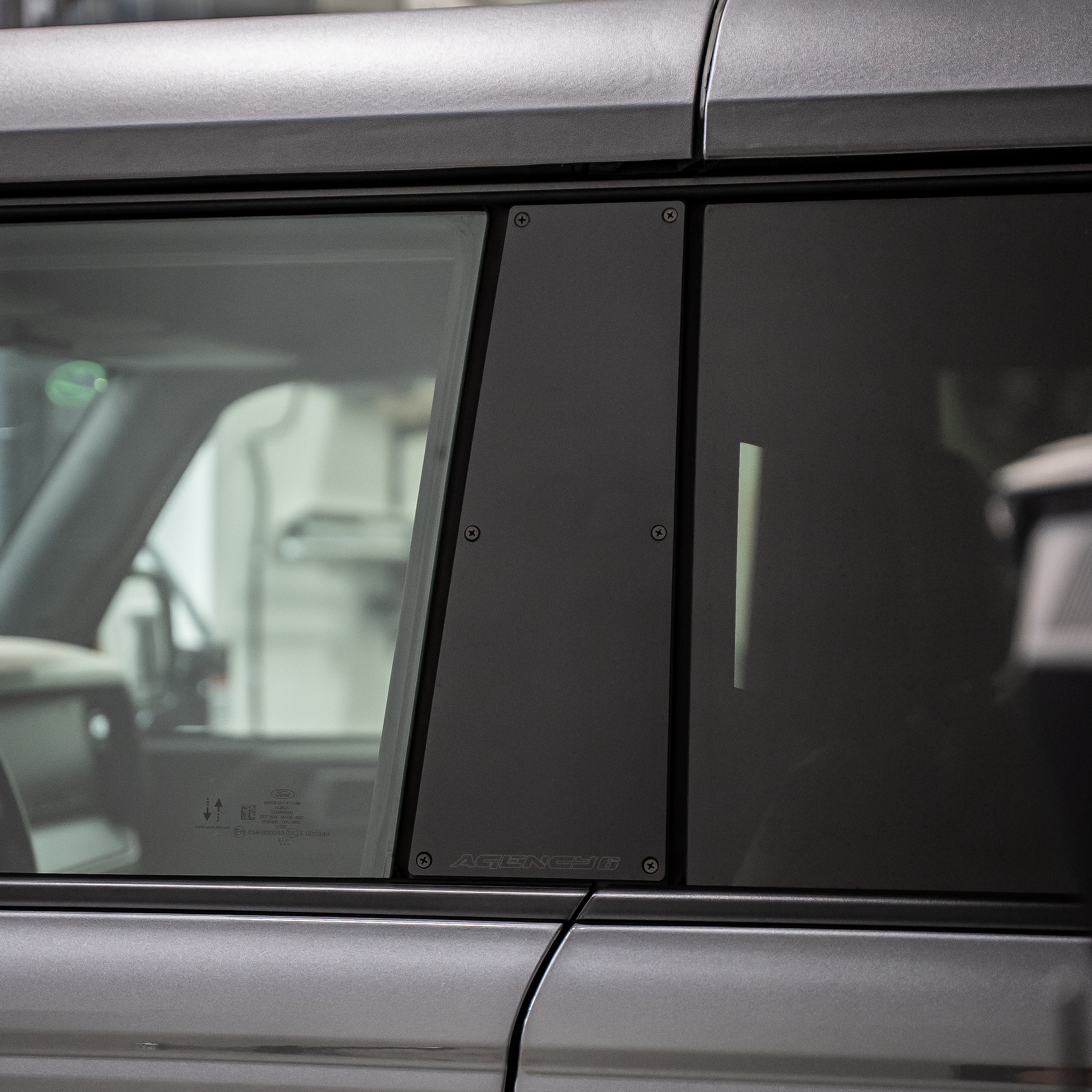 Close-up of a car door with window and handle